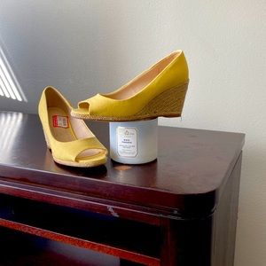 Stylish, never worn wedge. Will pair well with a lot!